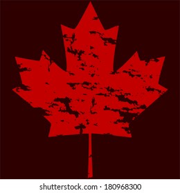 Grunge vector version of a Canadian maple leaf, over a dark red background