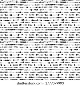 Grunge vertical small brushstrokes seamless vector pattern. Brush strokes dashes and shapes. Hand drawn abstract ink background. Lines of dashes, small splotches and blobs. Abstract wallpaper design