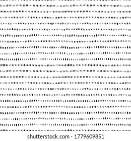 Grunge vertical small brushstrokes seamless vector pattern. Brush strokes dashes and shapes. Hand drawn abstract ink background. Lines of dashes, small splotches and blobs. Abstract wallpaper design