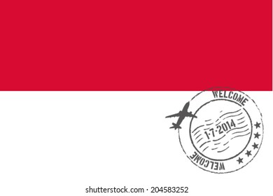 Grunge welcome rubber stamp with date on the flag of Monaco