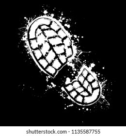 Grunge white silhouette of shoe print on black background