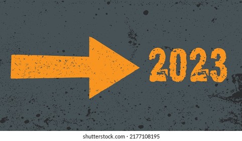 Grunge yellow arrow on gray texture pointing to 2023 next. Background 2023 New Year future vision concept. 