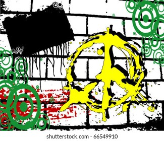 grunge yellow peace symbol on a brick wall