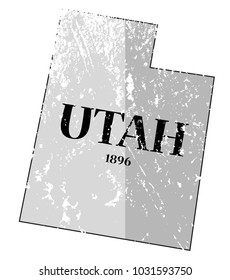 A grunged Utah state outline with the date of statehood isolated on a white background