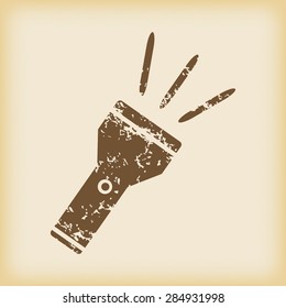 Grungy brown icon with image of flashlight, on beige background