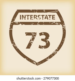 Grungy brown icon with image of shield and text Interstate 73, on beige background