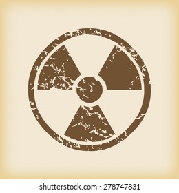Grungy brown icon with radio hazard symbol, on beige background