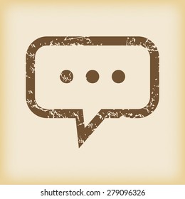Grungy brown icon with text bubble with three dots, on beige background