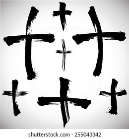 Grungy religion symbol. Set of black grungy crosses