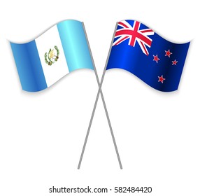 Guatemalan and NZ crossed flags. Guatemala combined with New Zealand isolated on white. Language learning, international business or travel concept.
