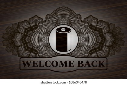 Guilloche decoration old battery icon and WELCOME BACK text wood realistic emblem. Brown classic background. Vector illustration. 