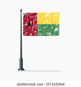 Guinea Bissau flag with scratches on flagpole with shadow in vector