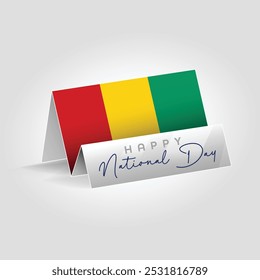 Guinea country paper flag standing on the ground. Happy national day flag design.