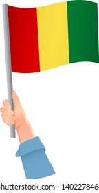 Guinea flag in hand icon