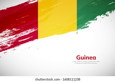 Guinea flag made in brush stroke background. National day of Guinea. Creative Guinea national country flag icon. Abstract painted grunge style brush flag background.