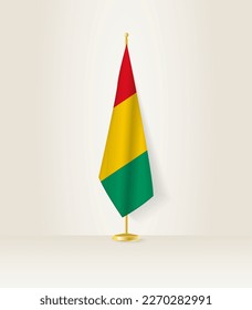 Guinea flag on a flag stand. Vector illustration.