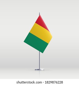 Guinea flag state symbol isolated on background national banner. Greeting card National Independence Day of the Republic of Guinea. Illustration banner with realistic state flag.