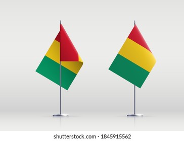 Guinea flag state symbol isolated on background national banner. Greeting card National Independence Day of the Republic of Guinea. Illustration banner with realistic state flag.