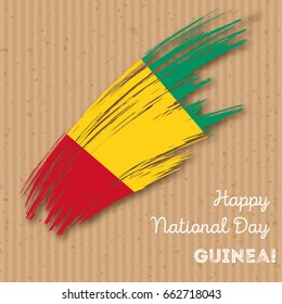 Guinea Independence Day Patriotic Design. Expressive Brush Stroke in National Flag Colors on kraft paper background. Happy Independence Day Guinea Vector Greeting Card.