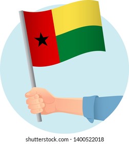 Guinea-Bissau flag in hand. Patriotic background. National flag of Guinea-Bissau vector illustration