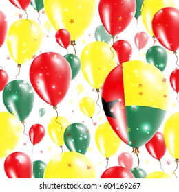 Guinea-Bissau Independence Day Seamless Pattern. Flying Rubber Balloons in Colors of the Guinea-Bissauan Flag. Happy Guinea-Bissau Day Patriotic Card with Balloons, Stars and Sparkles.