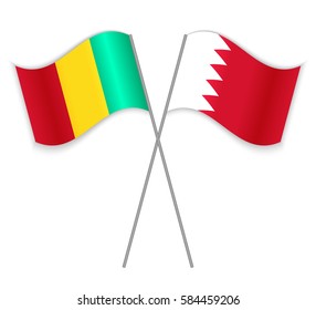 Guinean and Bahraini crossed flags. Guinea combined with Bahrain isolated on white. Language learning, international business or travel concept.