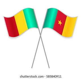 Guinean and Cameroonian crossed flags. Guinea combined with Cameroon isolated on white. Language learning, international business or travel concept.