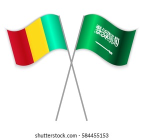 Guinean and Saudi Arabian crossed flags. Guinea combined with Saudi Arabia isolated on white. Language learning, international business or travel concept.