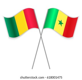 Guinean and Senegalese crossed flags. Guinea combined with Senegal isolated on white. Language learning, international business or travel concept.