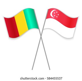 Guinean and Singaporean crossed flags. Guinea combined with Singapore isolated on white. Language learning, international business or travel concept.