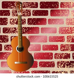 Guitar against a brick wall