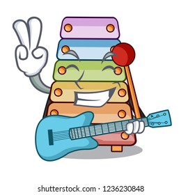 With guitar colorful toy xylophone on mallets mascot