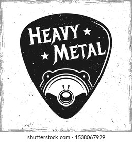 Guitar pick or mediator with speaker and text heavy metal. Vector design template isolated on background with removable textures