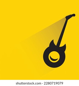 guitarra con sombra sobre fondo amarillo