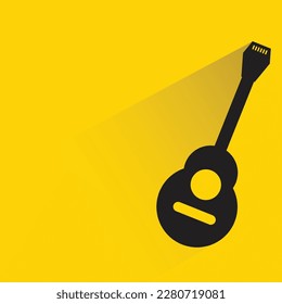 guitar with shadow on yellow background