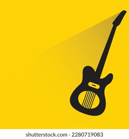 guitar with shadow on yellow background