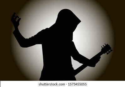 Guitarist in the hood on the background of the spotlight