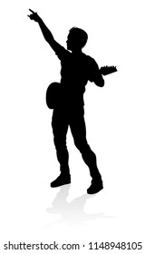 A guitarist musician in detailed silhouette playing his guitar musical instrument.