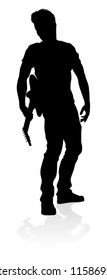 A guitarist musician in detailed silhouette playing his guitar musical instrument.