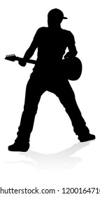 A guitarist musician in detailed silhouette playing his guitar musical instrument.