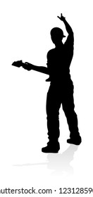A guitarist musician in detailed silhouette playing his guitar musical instrument.