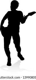 A guitarist musician in detailed silhouette playing his guitar musical instrument.