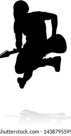 A guitarist musician in detailed silhouette playing his guitar musical instrument.