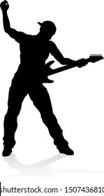 A guitarist musician in detailed silhouette playing his guitar musical instrument.