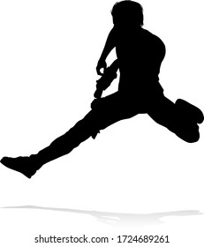 A guitarist musician in detailed silhouette playing his guitar musical instrument.