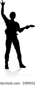 A guitarist musician in detailed silhouette playing his guitar musical instrument.