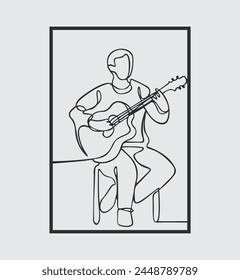 Guitarist sitting and playing guitar 