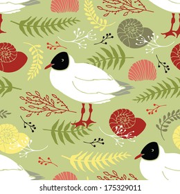 Gulls on the coast with shells, twigs, ferns and leaves