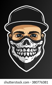 A guy in a baseball cap, and a bandana with a skull pattern. On dark background.