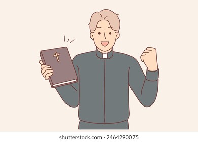 Guy in clothes of catholic priest rejoices at completing studies of bible, allowing to become rector of church. Happy man working in christian church showing book with crucifix on cover